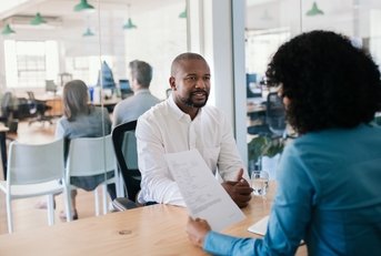  job applicant answering questions during an office interview