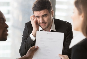 worried male job candidate interested in company vacancy
