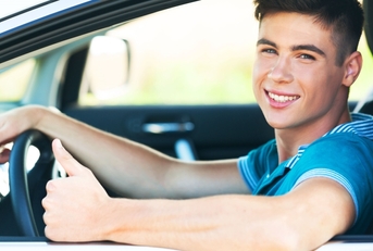 Teen driving a car
