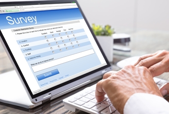 A man is answering an online survey