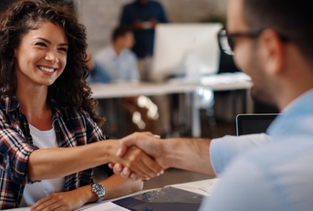 woman signing contracts and handshake with a manager