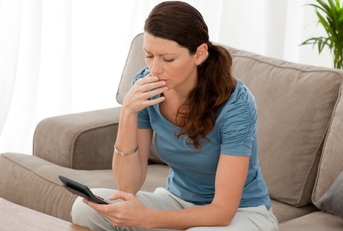 anxious woman calculating her debts