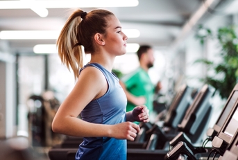 A woman working out on a treadmill