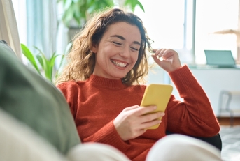 Woman playing on mobile phone