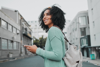 woman with cellphone in the street