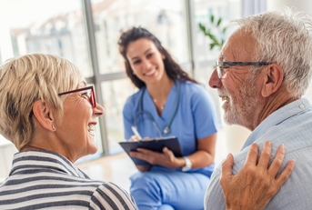 female nurse talking to senior patients