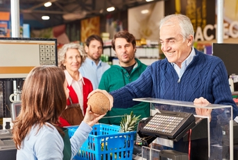 customer paying at the supermarket cashier 