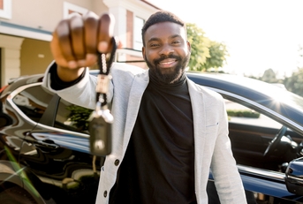 car seller holding car keys
