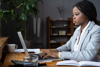 businesswoman types response to customer