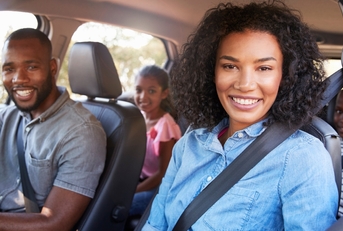 Happy family in car