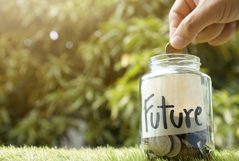 Person putting money in a jar labeled "future"