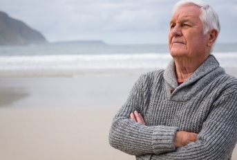 thoughtful senior man standing 