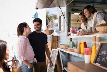 Happy people at a food truck