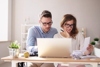 couple doing taxes and family budget