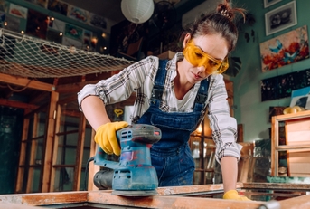 Woman sanding wood