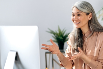 mature asian woman communicates by video call