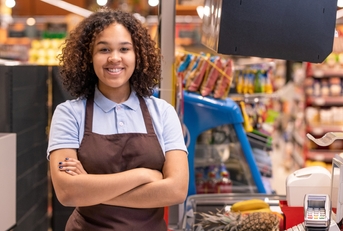 young smiling female sales clerk