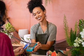 Woman making a purchase at a business