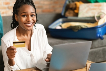 Adult woman using a credit card