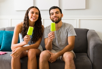 couple enjoying delicious popsicles