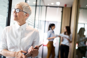proud business woman standing in lobby