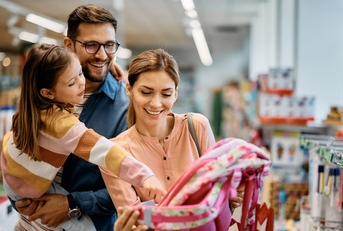 Family buying a backpack