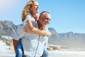 mature couple enjoying beach vacation