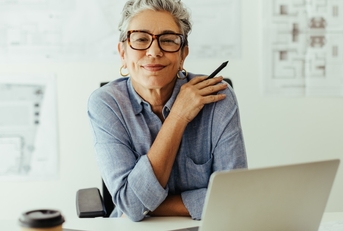 confident senior businesswoman posing at work