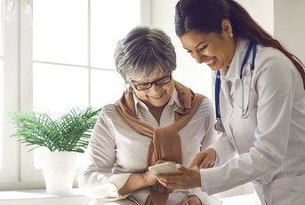 caring doctor teaches female patient