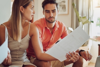 young couple arguing about utility bills