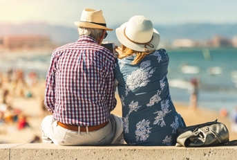 senior couple enjoying time on beach