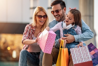 Couple with doughter after shopping