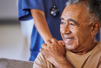doctor offering support to senior patient