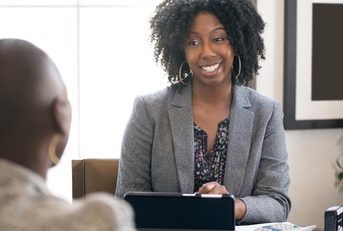 business woman talking to male candidate