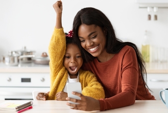 Mother and daughter looking at phone