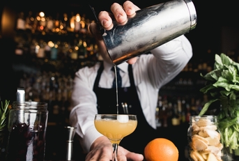 bartender pouring cocktail