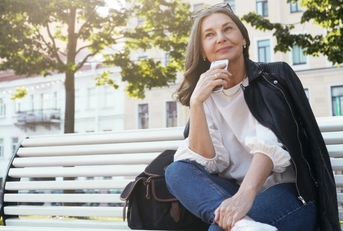 senior woman on bench outdoors