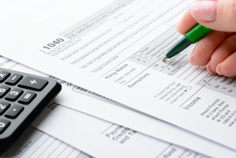 female hand and tax form