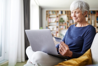senior woman using credit card