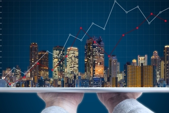 buildings and tablet real estate concept 