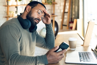 african freelancer with headache