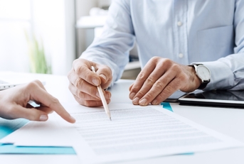 businessman discussing contract with female client