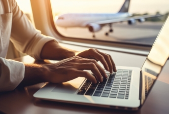 using a laptop while on an airplane