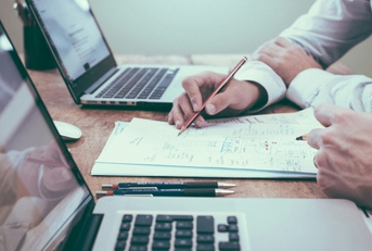 person holding pencil