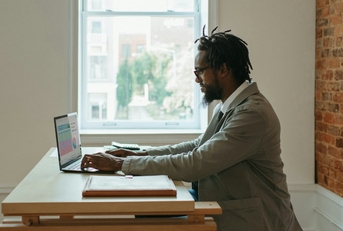 african american businessman using laptop
