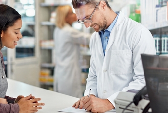 pharmacist writing prescription