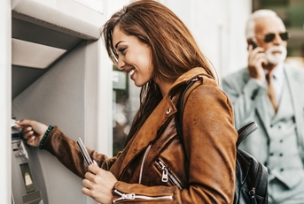 Woman taking money out of an ATM