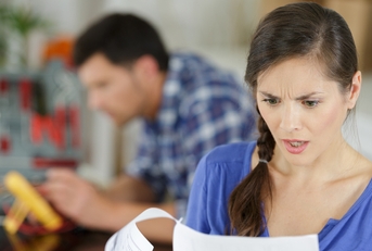 women looking at expensive bill