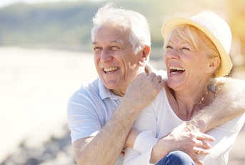 senior couple relaxing by the sea