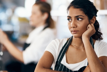 female waitress unhappy working at cafe